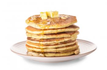 Tasty pancakes with butter on white background�
