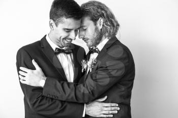 Black and white portrait of happy gay couple on their wedding day�