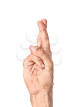 Male hand with crossed fingers on white background�