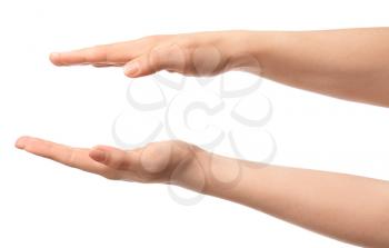 Hands of woman holding something on white background�