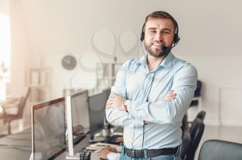 Portrait of male technical support agent in office�