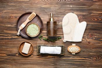 Set of bath accessories on wooden background�