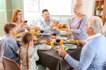 Family celebrating Thanksgiving Day at home�