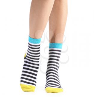 Legs of young woman in socks on white background�