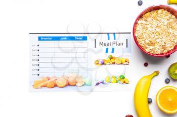 Healthy products and meal plan on white background�