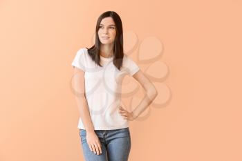 Woman in stylish t-shirt on color background�