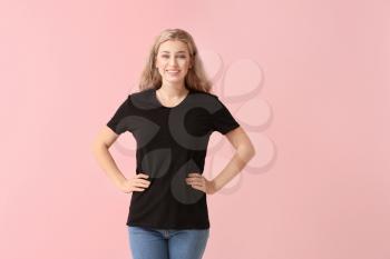 Woman in stylish t-shirt on color background�