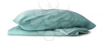 Pillow and clean bed sheet on white background�