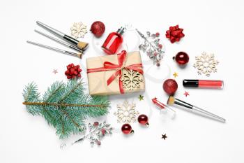 Christmas composition with cosmetics on white background�