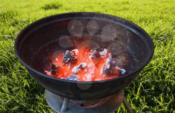 Red hot burning charcoal preparing for grilling outdoors