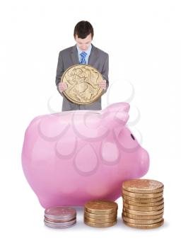 Young businessman with pigggy bank isolated on white background