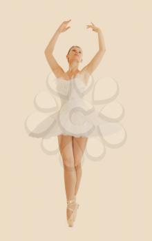 
beautiful ballerina in classical tutu and pointe isolated and retro toning