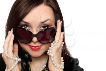 Royalty Free Photo of a Woman Wearing Sunglasses Holding Pearls