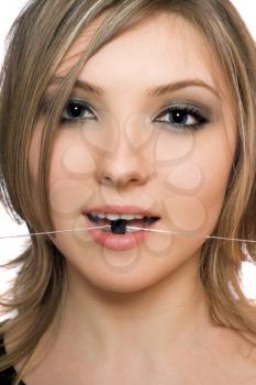 Royalty Free Photo of a Woman With a Bead in Her Mouth