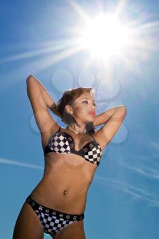 Royalty Free Photo of a Girl Wearing a Bikini in the Sun