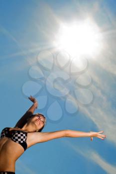Royalty Free Photo of a Girl Reaching to the Sun