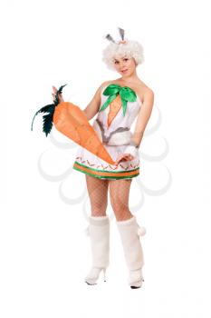 Royalty Free Photo of a Girl in a Bunny Suit Holding a Large Carrot