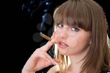 Royalty Free Photo of a Woman Smoking a Cigar