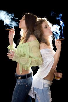 Royalty Free Photo of Two Women Smoking Cigars and Drinking