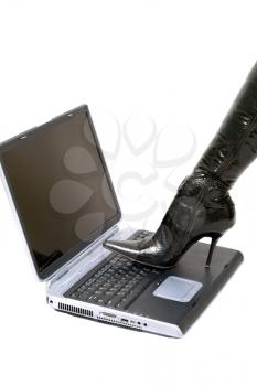 Royalty Free Photo of a Boot on a Laptop