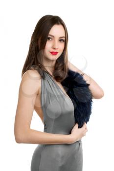 Playful sexy woman wearing grey dress with fur. Isolated on white