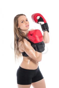 Portrait of blond woman posing with red boxing gloves. Isolated on white