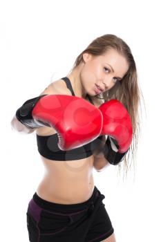 Portrait of sporty woman boxing in the studio. Isolated on white