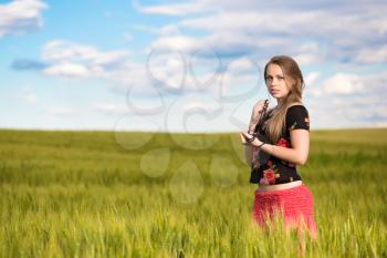 Alluring young lady posing on the wheat field