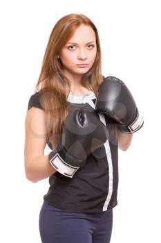 Young sporty lady with black boxing gloves. Isolated on white