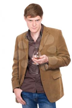 Handsome man in terracotta jacket with a glass of whiskey. Isolated on white