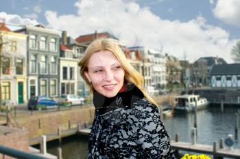 Girl on the waterfront in the Dutch town of Gorinchem. Netherlands