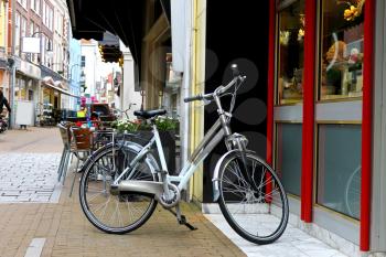 Bike is parked near  shop in Gorinchem. Netherlands
