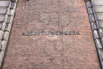 Inscription Augustinian church  on the wall of church in Dordrecht. Netherlands