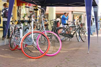 DORDRECHT, THE NETHERLANDS - SEPTEMBER 28: Bicycles and people on the  street on September 28, 2013 in Dordrecht, Netherlands