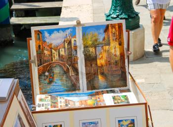 VENICE, ITALY - MAY 06, 2014: Equipment and drawings street artist in Venice, Italy