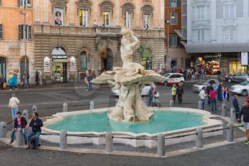 ROME, ITALY - MAY 03, 2014: People in the area near Triton Fountain in Rome, Italy