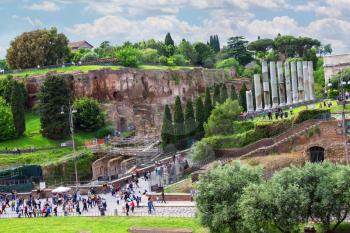 ROME, ITALY - MAY 04, 2014: Tourists visiting the sights in a historical part town near the Colosseum in Rome, Italy