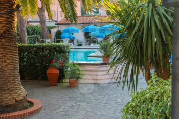 Small pool in the courtyard of the villa in sea resort. Elba Island, Italy