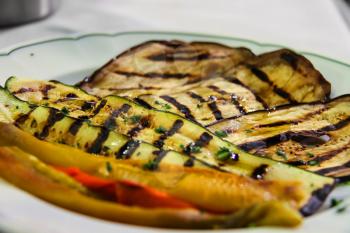 Plate with grilled vegetables in traditional Italian restaurant