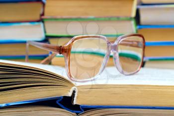 Royalty Free Photo of Reading Glasses on a Stack of Books