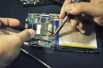 Tablet repair. Soldering the battery contacts