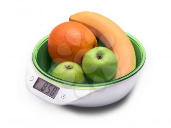 weighing fruit for diet on electronic scales. isolated on white