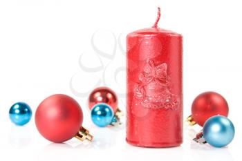 Royalty Free Photo of a Candle and Christmas Ornaments