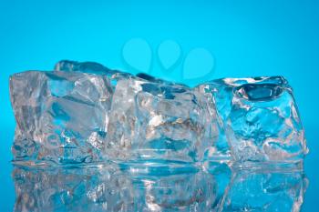 Photo of ice cubes on a blue background