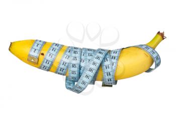 Measure tape wrapped on banana. Isolated on white background
