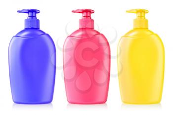 three color plastic bottles with liquid soap 