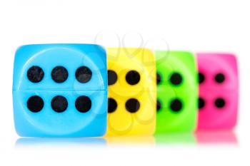 Colorful dice aligned, isolated on white background