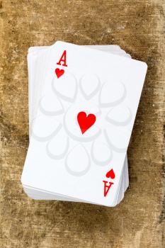 A poker card deck with ace of hearts on the top