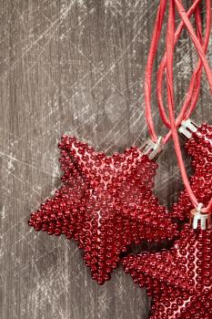 Christmas stars on a wooden background with copy-space