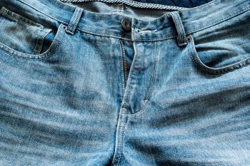 Fragment of the front of the classic blue jeans